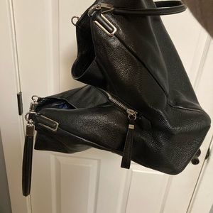 Like new genuine Coach bag. Zipper middle, holds iPad, wallet. 13x10x4